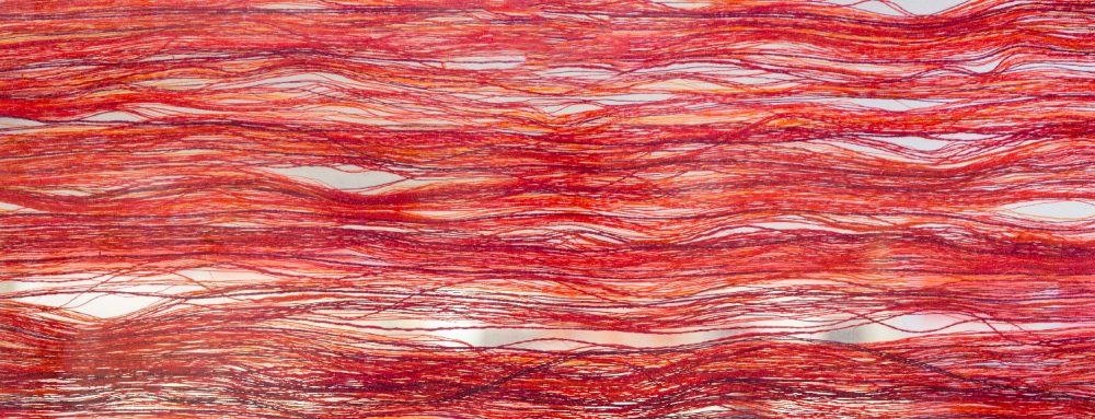 An abstract image with red and white horizontal lines.