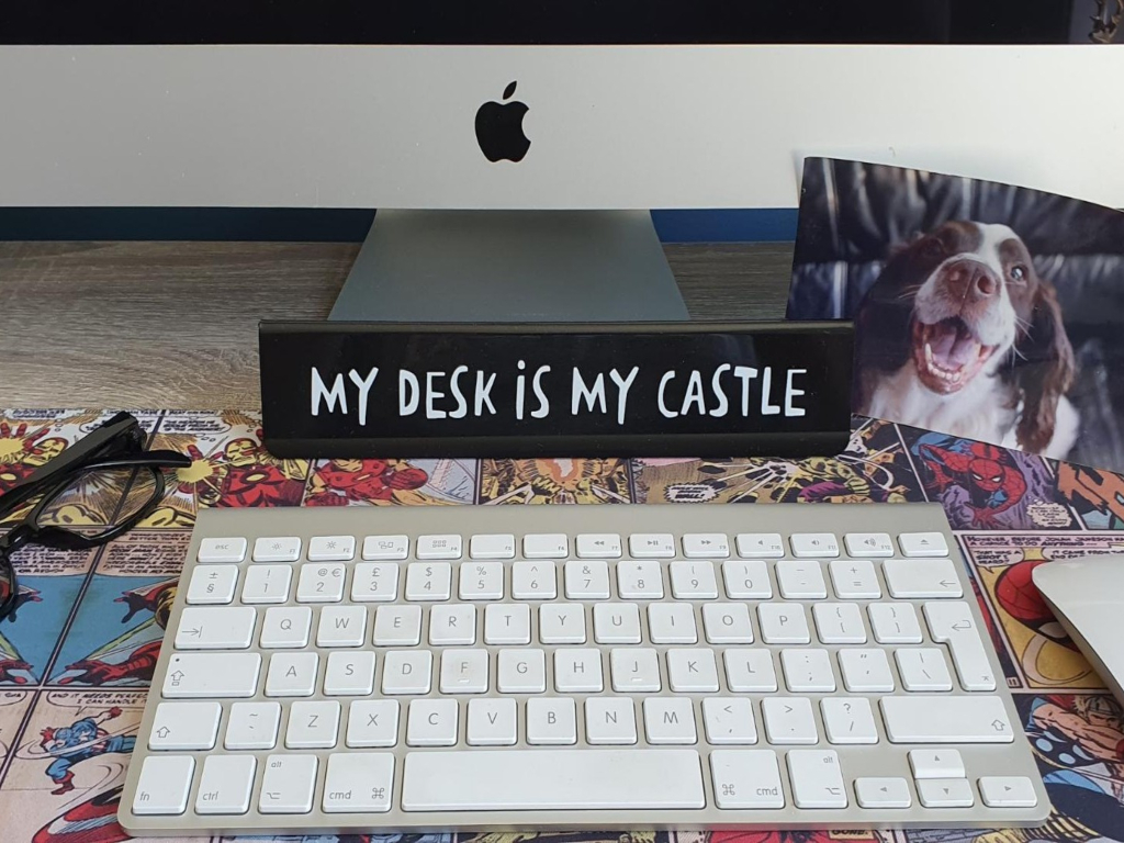 Keyboard with plaque that says 'my desk is my castle' 
