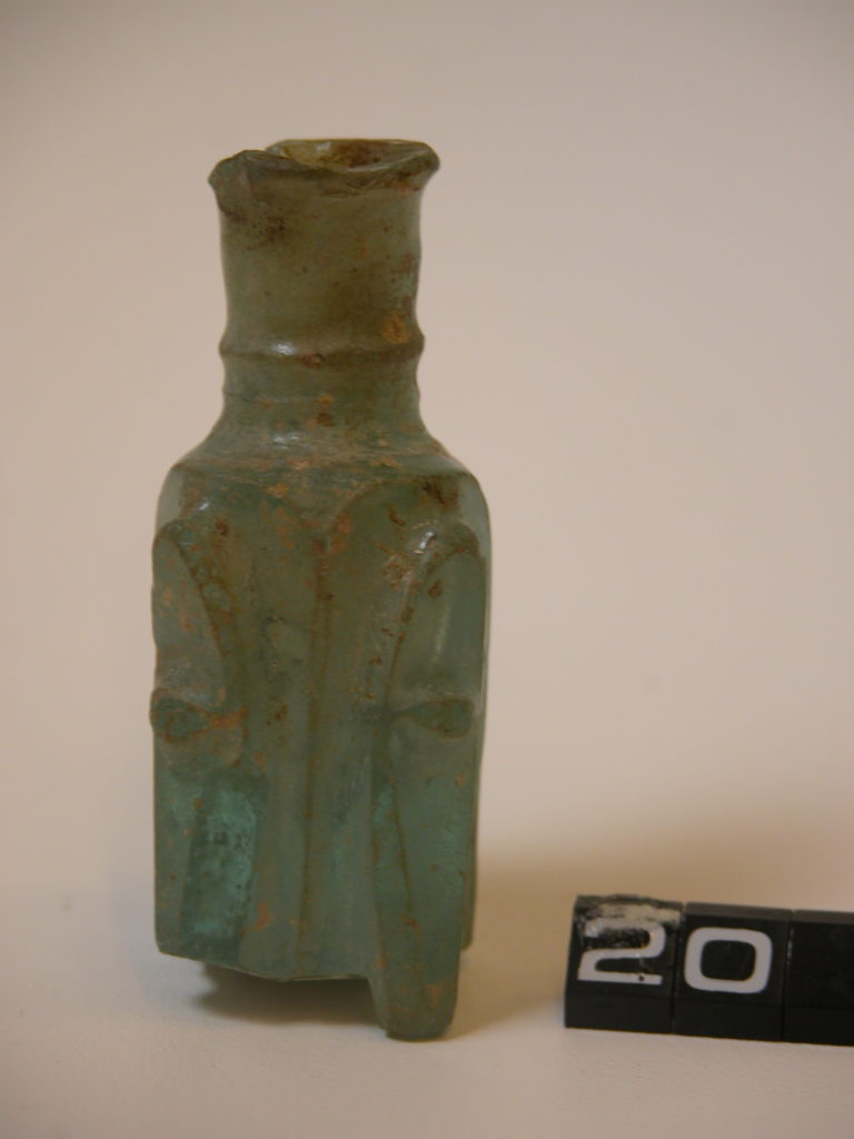 Roman green glass bottle with square body and cast or engraved  pattern