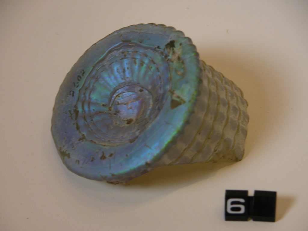 Base of a pale blue glass vessel  with fluted pattern