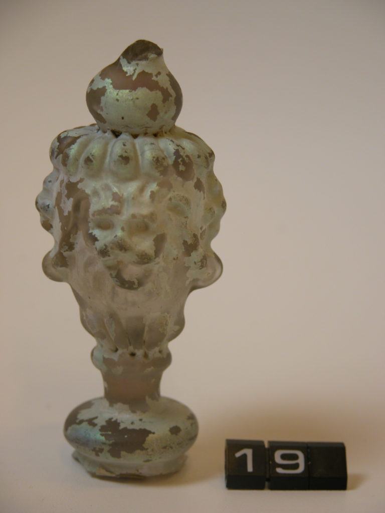 Lion’s head, part of a vase or glass