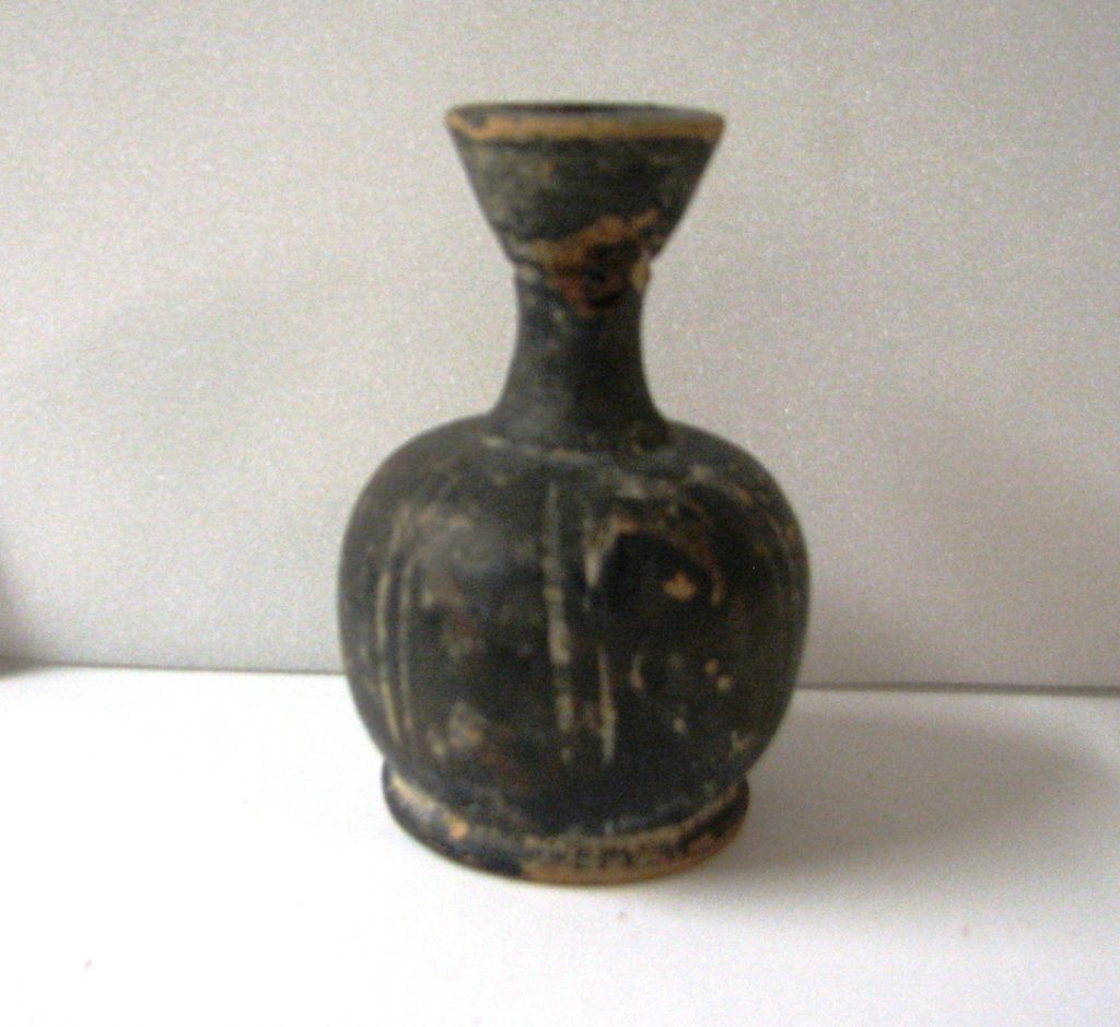 Vase with longitudinal furrows