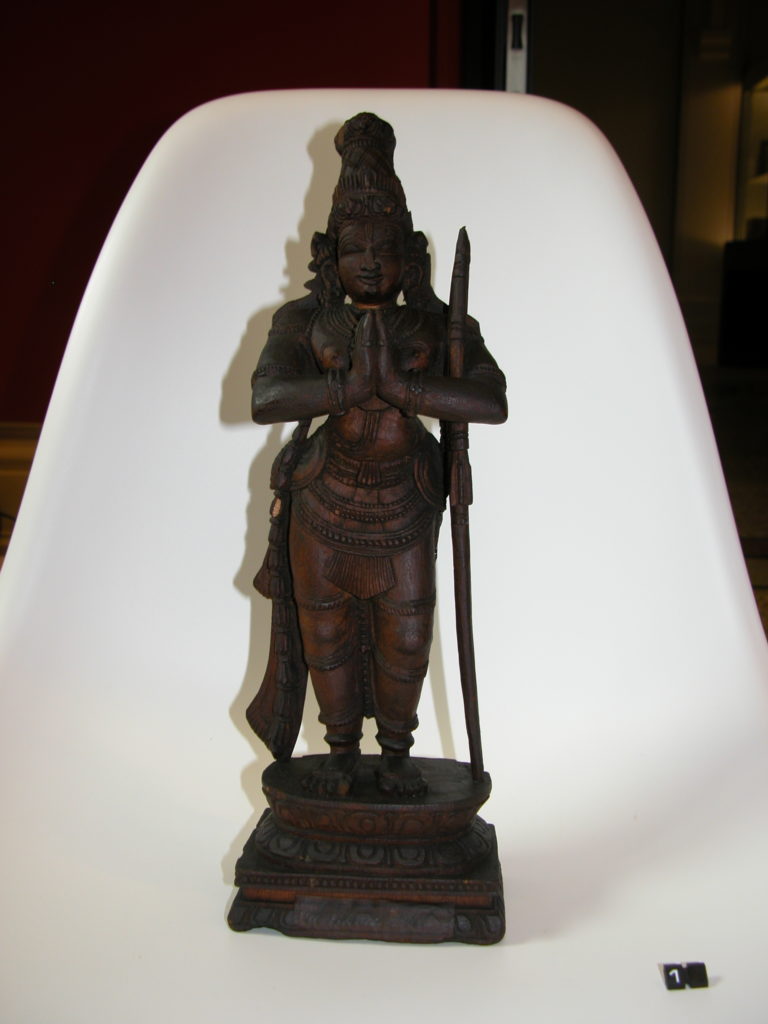 Carved figure of a standing Lord Murugan