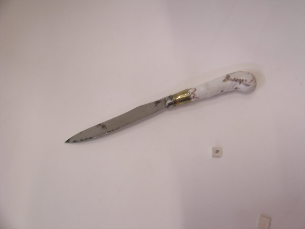 Knife with porcelain handle