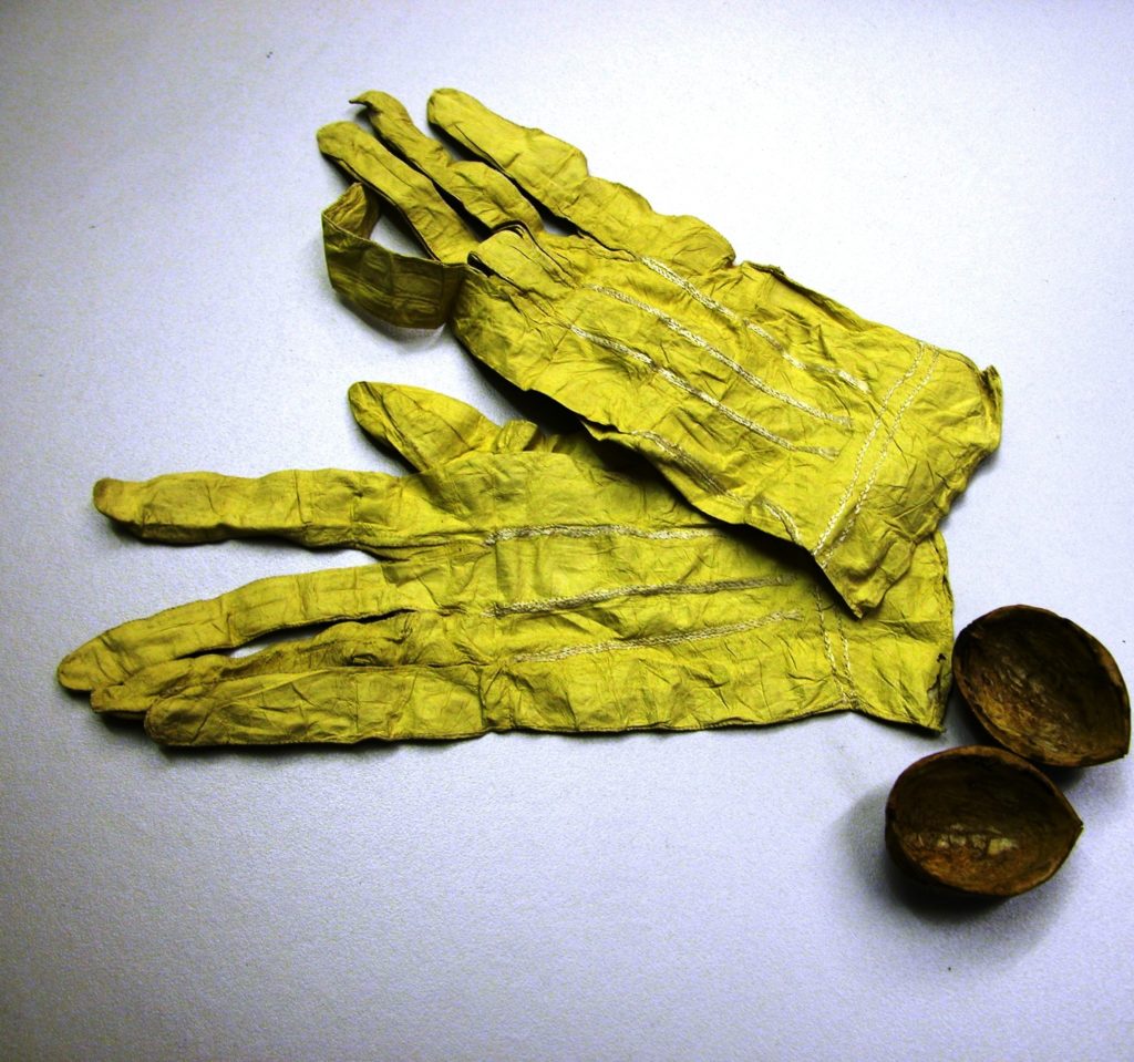 Chicken skin gloves in a walnut shell