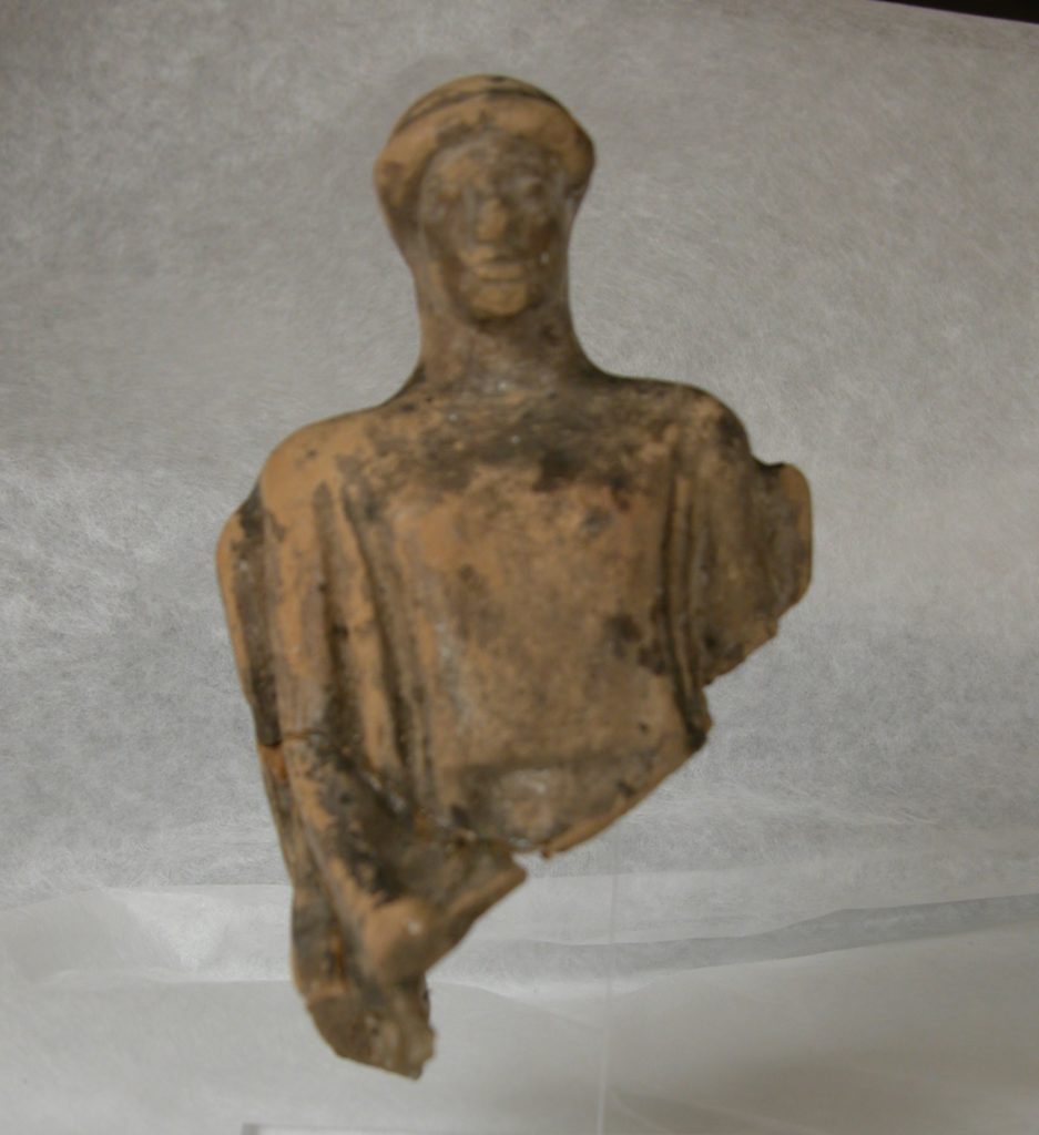 Seated figure with headdress Terracotta