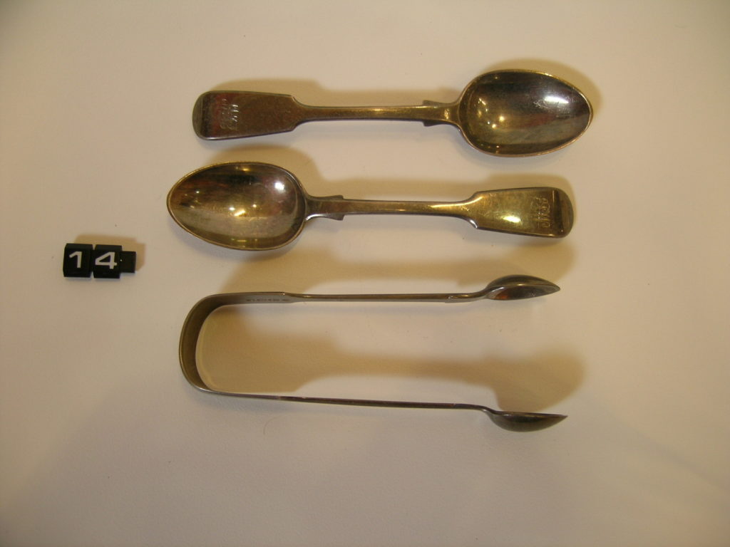 Silver teaspoons and sugar tongs