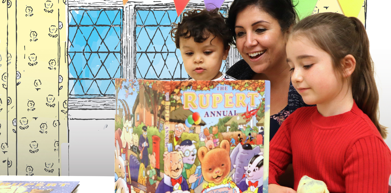 Family reading Rupert Bear annual