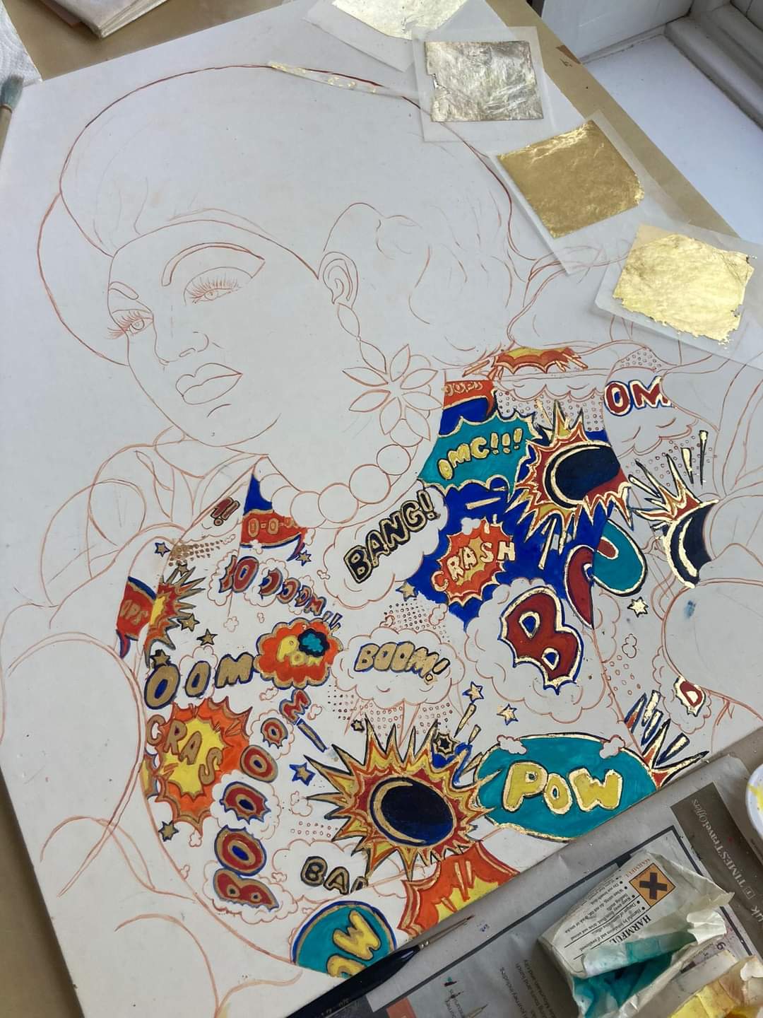 Paint and gold leaf applied to the unfinished portrait
