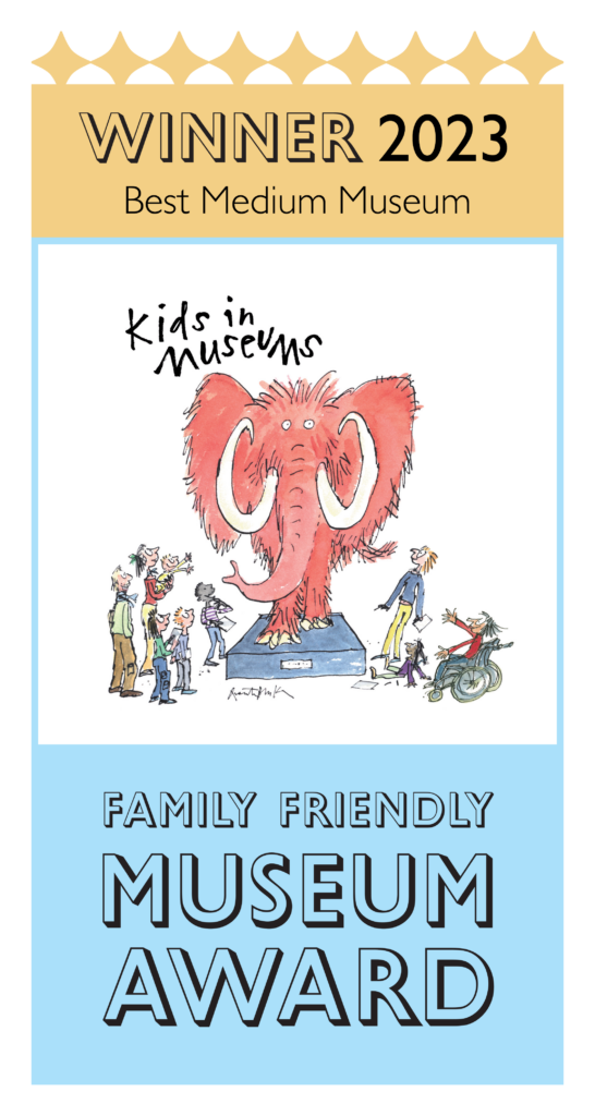 A graphic with gold top that reads 'Winner 2023 Best Medium Museum' in the middle is a quentin blake illustration of people looking at a pink mammoth. Text on blue underneath reads 'Family Friendly Museum award'